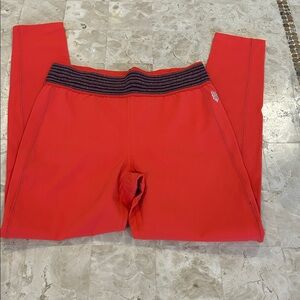 Free People Movement orange leggings /purple stripes on the waistband Size S